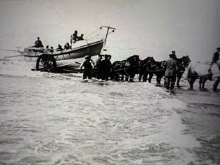 boat being towed by horses